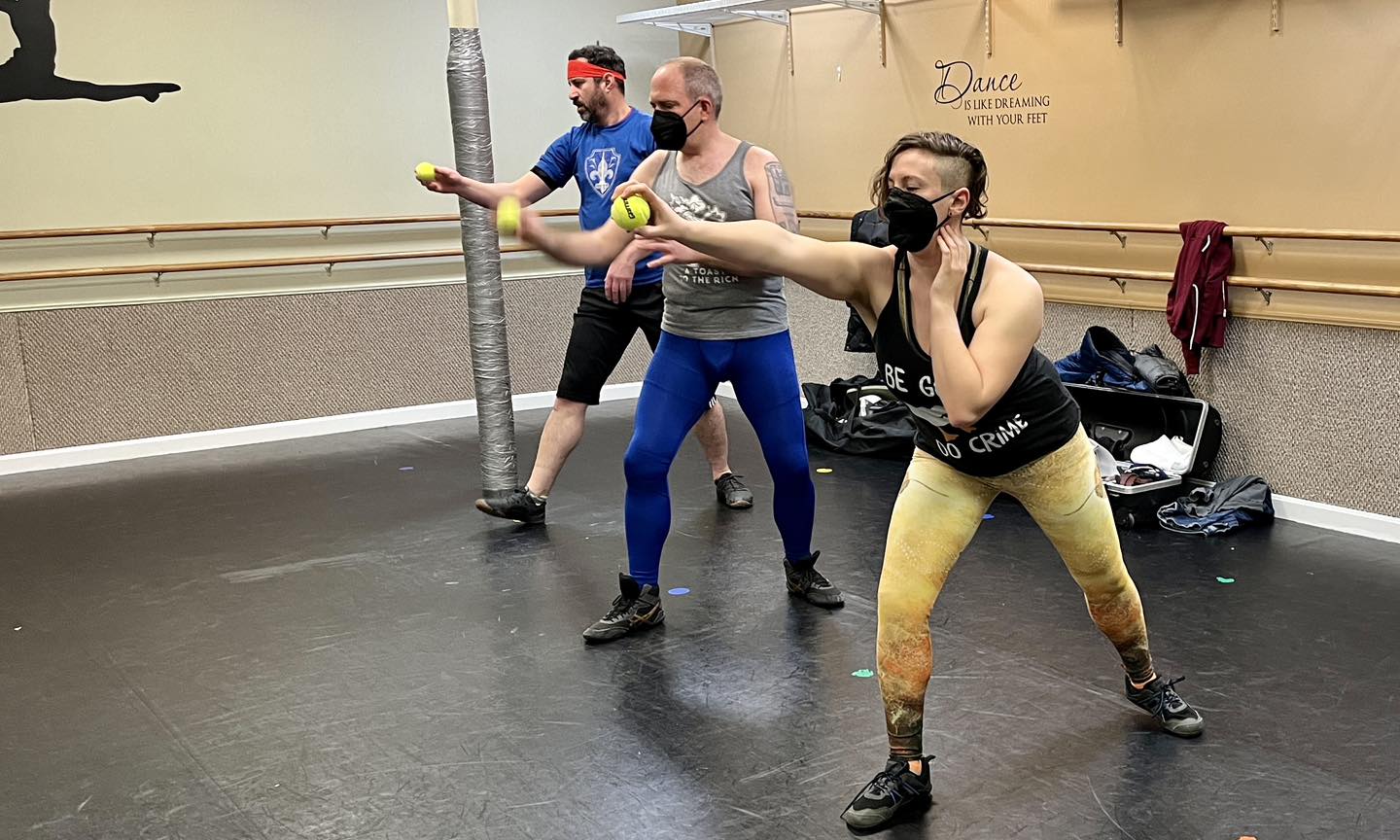 Boston HEMA rapier fencers working on their lunges with a tennis ball drill.