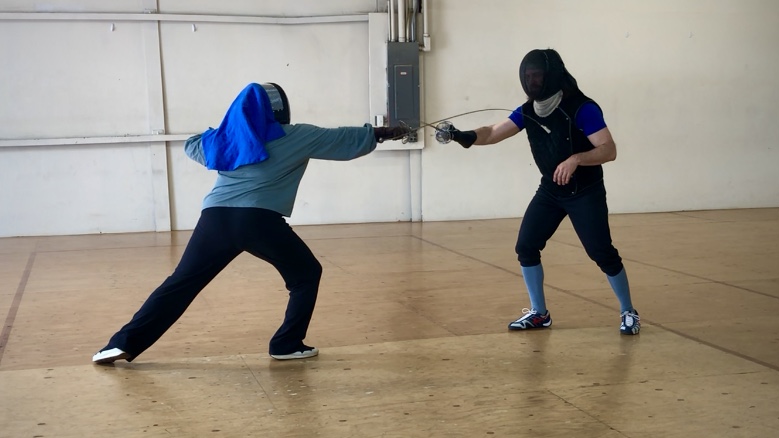Justin leads a Boston HEMA private historical fencing lesson with a new rapier fencer who lunges with opposition.