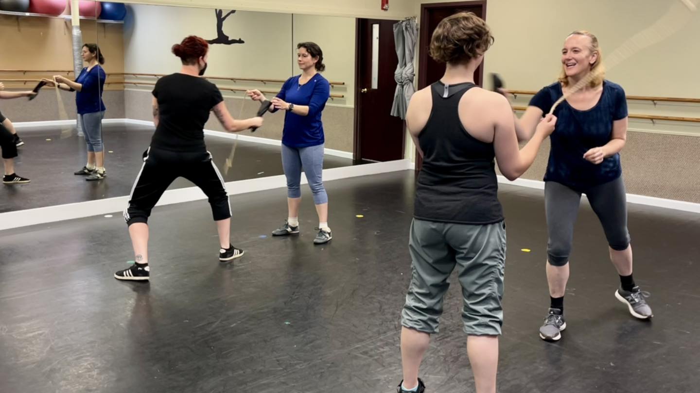 Four Boston HEMA and SCA rapier fencers warming up with the glove-rope game.