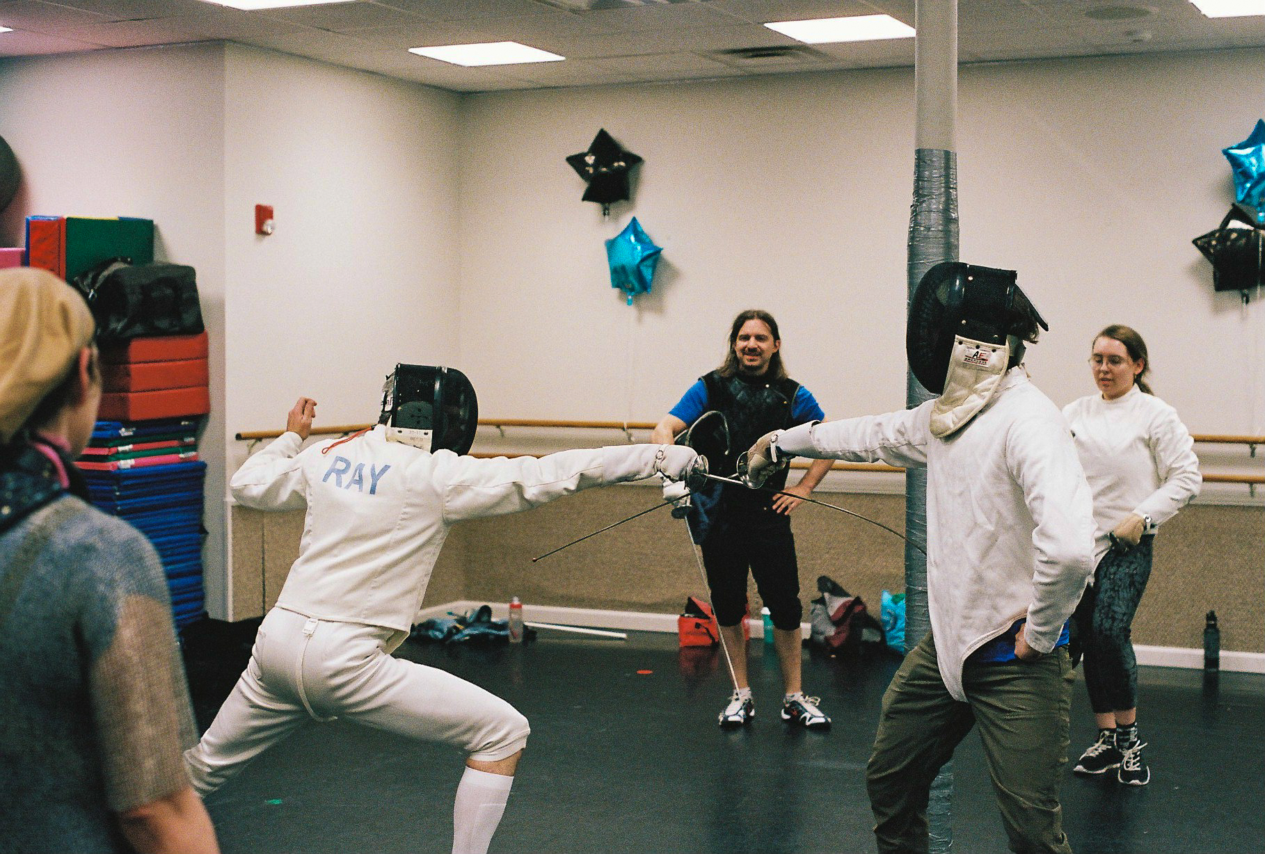 Two Boston classical fencers showing the internal flanconade with Italian foil
